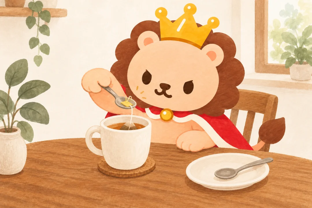 ランキンがマグから落ちたティーバッグのタグをスプーンですくおうと真剣な顔。すぐ横の皿にもう一本のスプーンが整列している